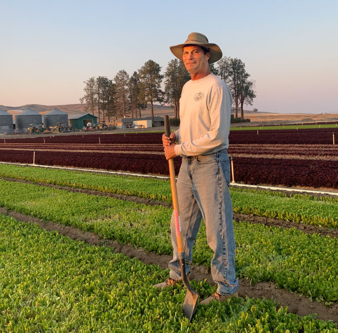 farmer standing in a field